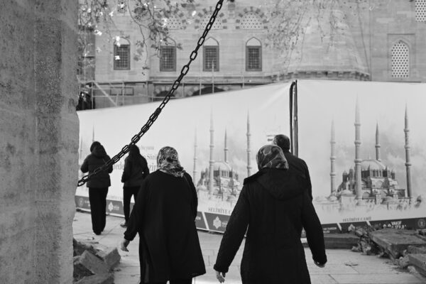 Chain, Minaret and People Clad in Black